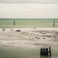 Buy canvas prints of Wooden posts in the sea. by Paul Cullen