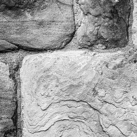 Buy canvas prints of Textured stone wall by Paul Cullen