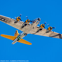 Buy canvas prints of Boeing B17 Flies Overhead In Deep Blue Sky by Steve de Roeck