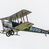 Buy canvas prints of Avro 504K flies past in a cloudy sky by Steve de Roeck