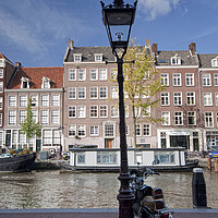 Buy canvas prints of Canalside, Amsterdam by Peter Towle