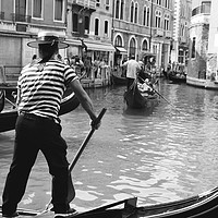 Buy canvas prints of A gondola boatman in Venice by Aleksey Zaharinov