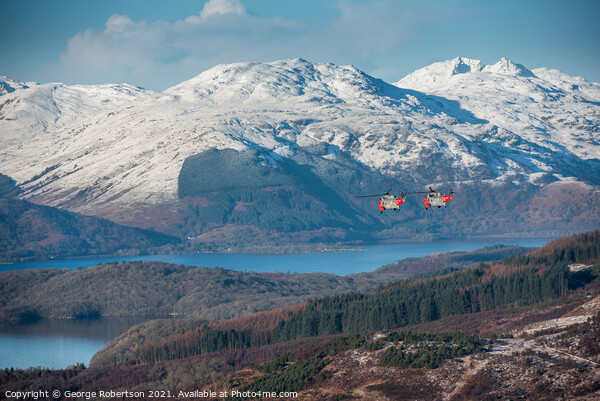 Two Sea Kings flying low over Loch Lomond Picture Board by George Robertson