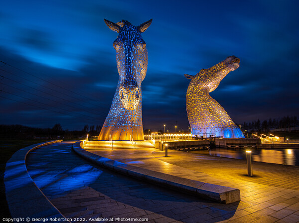 The Kelpies in Blue and Yellow colours in support of Ukraine Picture Board by George Robertson