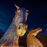 Buy canvas prints of The Kelpies light up in Blue and Yellow colours in support of Uk by George Robertson