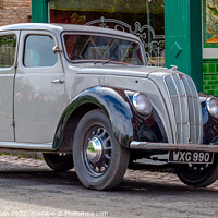 Buy canvas prints of A vintage Morris Eight parked on a street by George Robertson