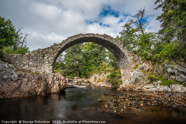 Old stone bridge in the village of Carrbridge Picture Board by George Robertson