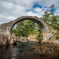 Buy canvas prints of Old stone bridge in the village of Carrbridge by George Robertson