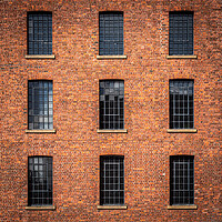 Buy canvas prints of Windows in Albert dock warehouse in Liverpool , England. by George Robertson