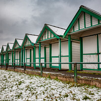 Buy canvas prints of Langland Bay Beach Huts in the snow by Dan Santillo