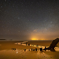Buy canvas prints of Helvetia Wreck and Worms Head at Night by Dan Santillo