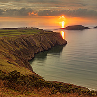 Buy canvas prints of Sunset over Worms Head, Rhossili Bay by Dan Santillo