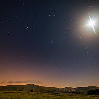 Buy canvas prints of The moon and stars over Pen y Fan and Corn Du by Dan Santillo