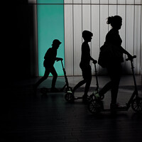 Buy canvas prints of Family of three on scooters  by Sara Melhuish