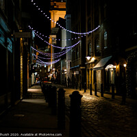 Buy canvas prints of Cobblestones and Christmas lights by Sara Melhuish