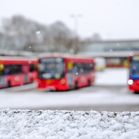 Buy canvas prints of A trio of London buses in the snow by Sara Melhuish
