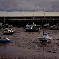 Buy canvas prints of Boats a low tide by Sara Melhuish