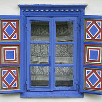 Buy canvas prints of A Romanian Farmhouse Window with shutters by Chris Langley