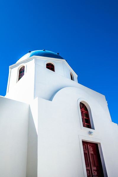 Santorini Blue domed Church Picture Board by Paul Andrews