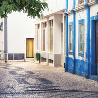 Buy canvas prints of Side Street in Lagos, Portugal by Kasia Design