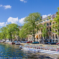 Buy canvas prints of Boatride on a colourful Amsterdam Canal by Kasia Design