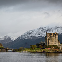 Buy canvas prints of Eileen Donan Castle Against Snowy Mountains by Rosalind White