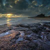 Buy canvas prints of Dawn at Bamburgh Castle by Clive Ashton