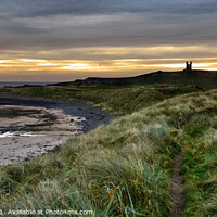 Buy canvas prints of First light at Dunstanburgh Castle by Chris Drabble