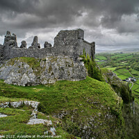 Buy canvas prints of Carreg Cennen Castle with moody clouds by Chris Drabble