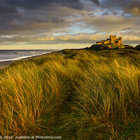 Buy canvas prints of Bamburgh Castle at sunset by Chris Drabble