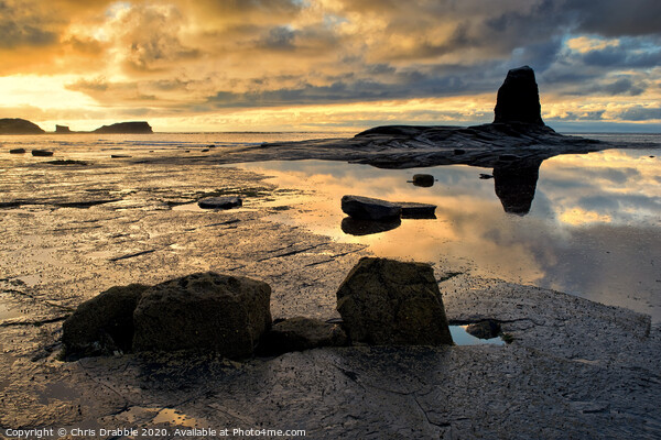 Black Nab at sunset. Saltwick Bay Picture Board by Chris Drabble