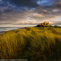 Buy canvas prints of Sunset at Bamburgh Castle by Chris Drabble