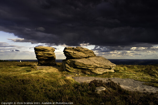 The Ox Stones caught in storm light Picture Board by Chris Drabble