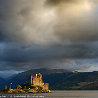 Buy canvas prints of Heavy clouds over Eilean Donan Castle by Chris Drabble