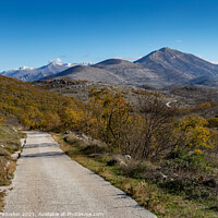 Buy canvas prints of Countryside road in Croatian mountains. Balkans. by Sergey Fedoskin