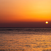 Buy canvas prints of Bright sunset with a big yellow sun under the sea surface. by Sergey Fedoskin