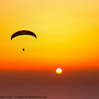 Buy canvas prints of Paraglider flying in the beautiful sky against the background of by Sergey Fedoskin