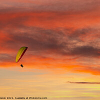 Buy canvas prints of Paraglider flying in the beautiful sky against the background of by Sergey Fedoskin