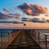 Buy canvas prints of Wooden pier and sunset over sea. by Sergey Fedoskin