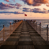 Buy canvas prints of Wooden pier and sunset over sea. by Sergey Fedoskin