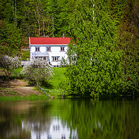 Buy canvas prints of Reflections of a white house on a small lake in Op by Hamperium Photography
