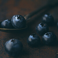 Buy canvas prints of Fresh blueberry in a teaspoon on a rough surface by Tartalja 