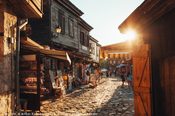 People walk through streets of ancient Nessebar Picture Board by Andrei Bortnikau