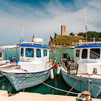 Buy canvas prints of Boats in the background of Nea-Fokea Tower, Greece by Andrei Bortnikau