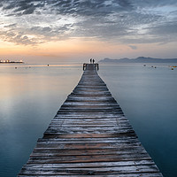 Buy canvas prints of Puerto de Alcudia beach pier at sunrise in Mallorc by Andrei Bortnikau