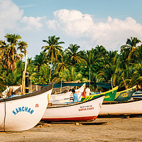 Buy canvas prints of Wooden fishing boats on Morjim beach, Goa, India by Andrei Bortnikau