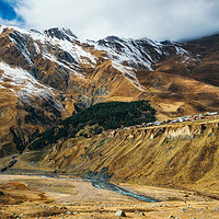 Buy canvas prints of Shepherd herding sheeps against the village by Andrei Bortnikau