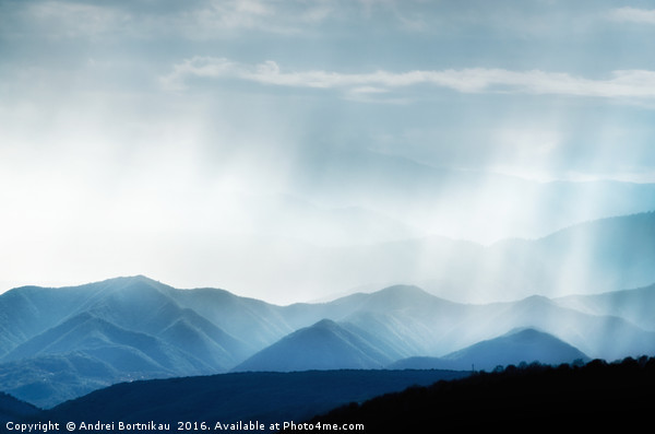 Hills with rainy ranges with sunlight Picture Board by Andrei Bortnikau