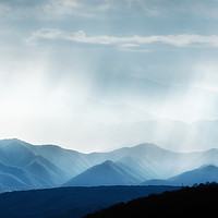 Buy canvas prints of Hills with rainy ranges with sunlight by Andrei Bortnikau