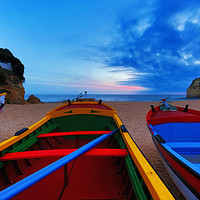 Buy canvas prints of Colorful fishing boats at Carvoeiro beach at the A by Thomas Herzog